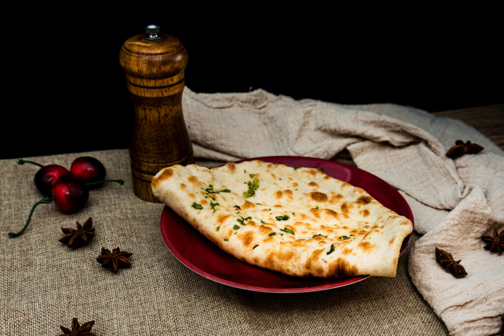 Origines et Histoire du Naan